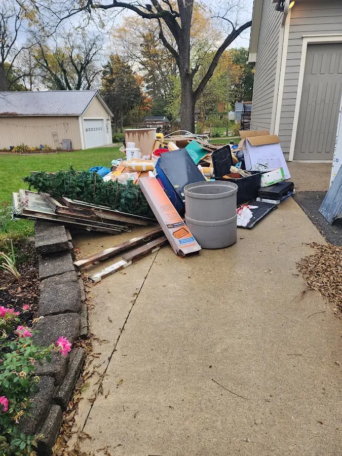 Dumpster being loaded with debris for 3 Yard Dumpster Rental in Potosi